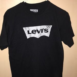 Plain black Levi’s Tee.
